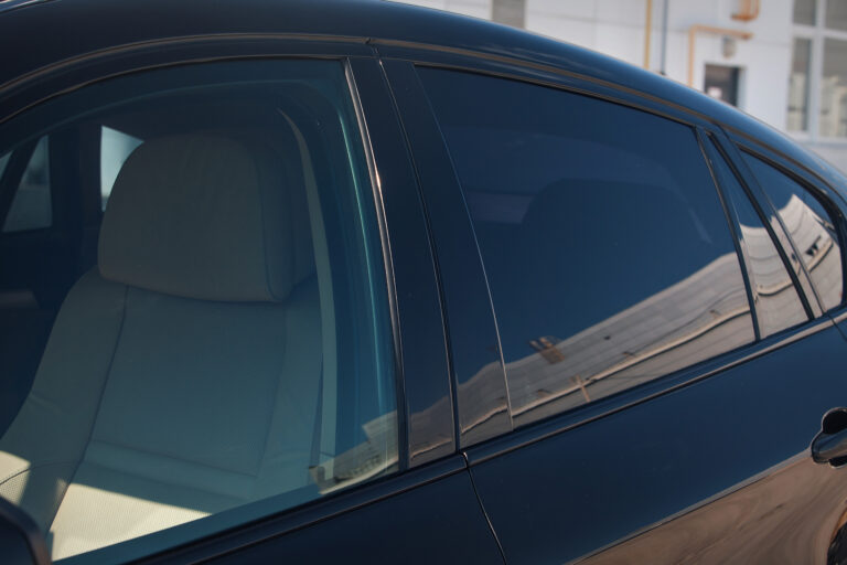 tinted black car Windows that reflect the glass ceiling